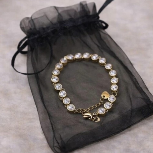 Gold bracelet with white stones like new