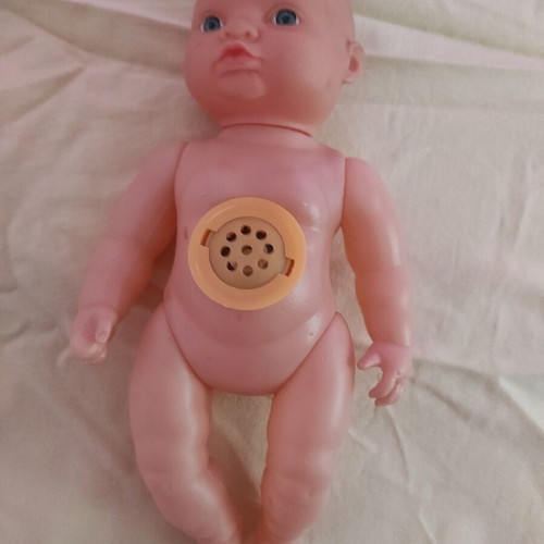 Plastic laughing doll 25cm like new