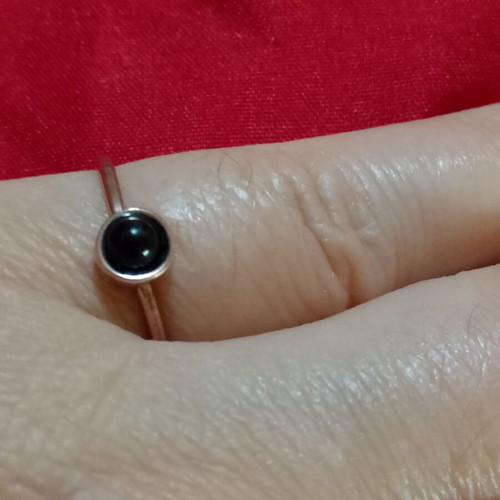 Ring with black stone in copper color, like new, inner diameter 16