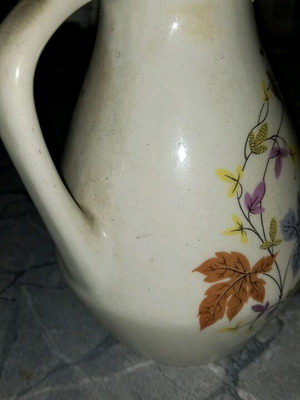Glass amphora jar used, white with wear on the rim
