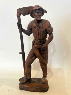 Vintage farmer figure with sickle made of resin with wood effect, used