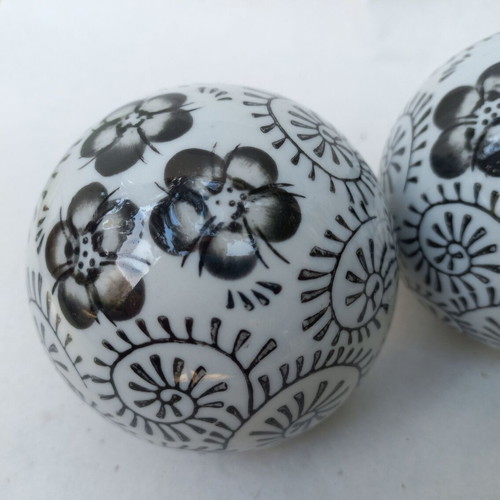 Vintage decorative porcelain spheres set like new with floral and geometric designs