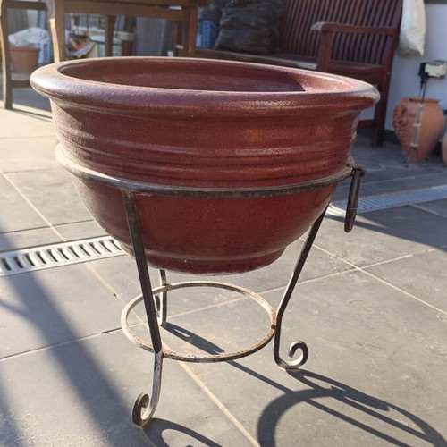 Large glazed ceramic flowerpot with decorative iron stand, like new
