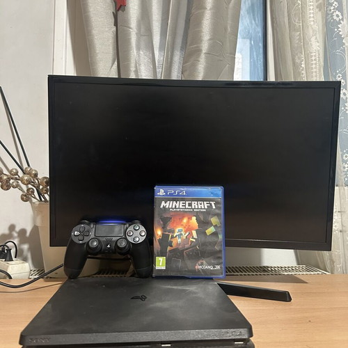 PlayStation 4 console with controller and Minecraft game, 500GB