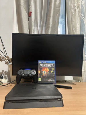 PlayStation 4 console with controller and Minecraft game, 500GB