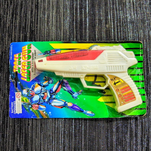 Vintage Space Laser Gun new, sealed in blister pack