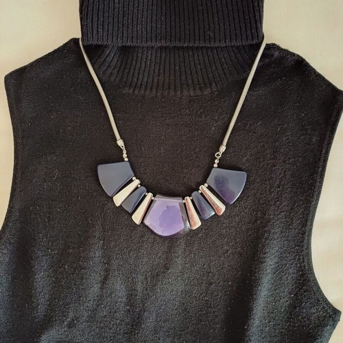 Geometric necklace used with blue and purple designs, Marks & Spencer
