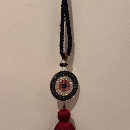 Long necklace with eye and tassel used, silver black and burgundy rhinestones