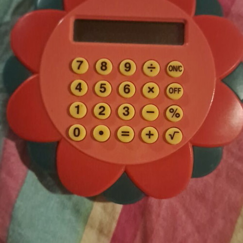 Flower-shaped calculator like new, pocket size