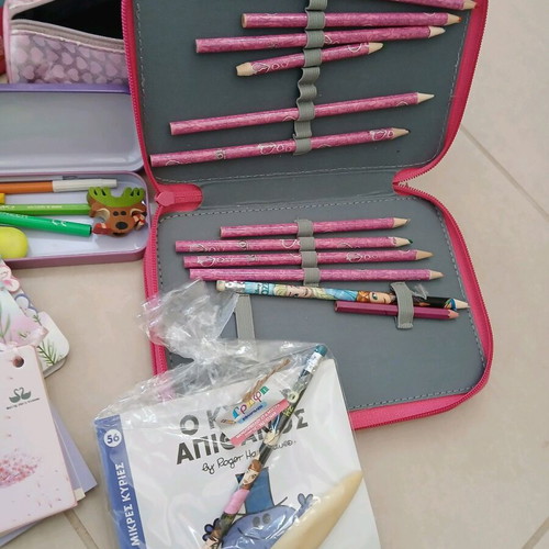 School supplies used, pencil cases, erasers, paints, notebooks, pencils
