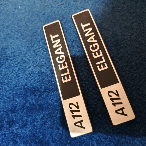 A112 badges new, pair