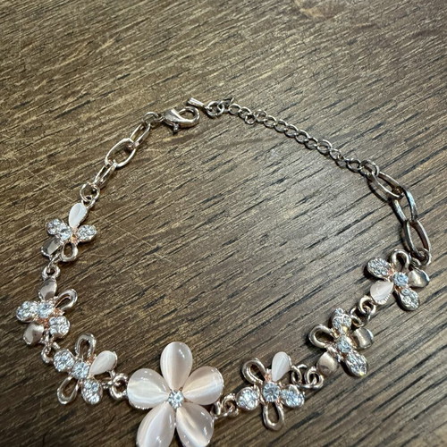 Rose gold bracelet with flowers and zirconia used