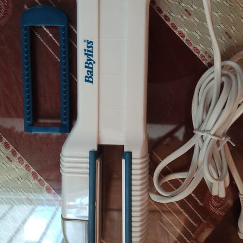 Hair straightener with water spray