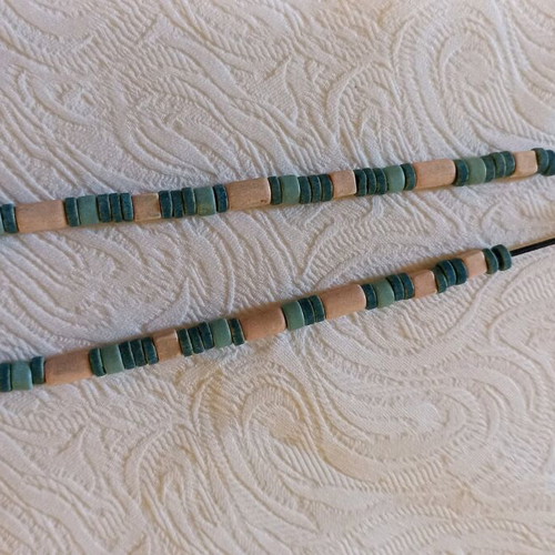Handmade necklace used with beads in pink, sky blue, and green shades