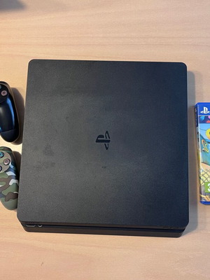PS4 Slim 500GB console with 2 DualShock 4 controllers and Chimparty game