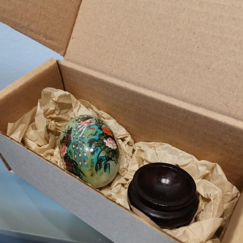 Asian marble egg used with hand-painted design and wooden base