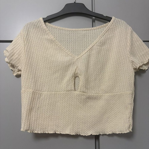 Women's cream crop top with V-neck and keyhole cut-out