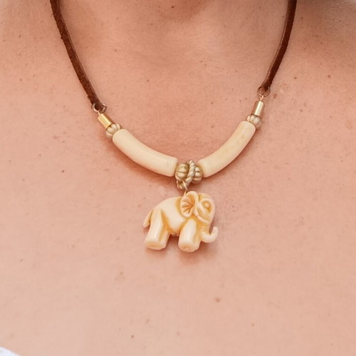 Ethnic necklace with brown leather cord and elephant pendant, vintage bakelite