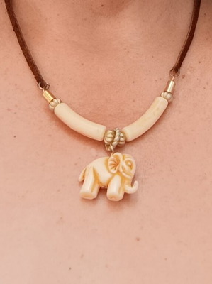 Ethnic necklace with brown leather cord and elephant pendant, vintage bakelite