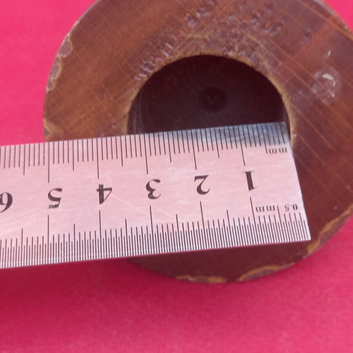 Wooden finial with brass tip