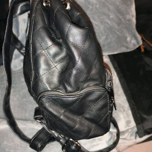 Backpack used, black with multiple pockets