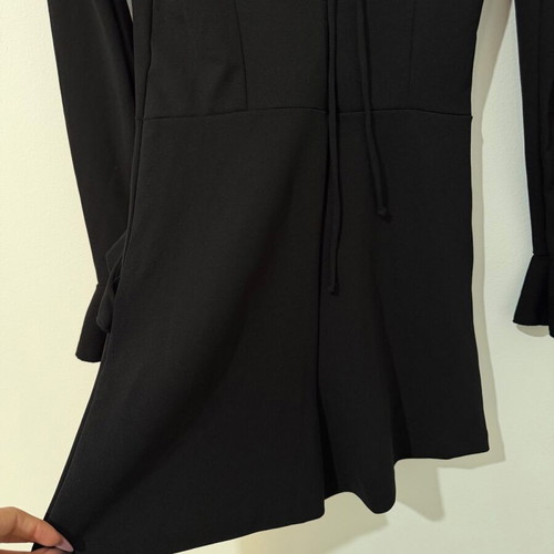 Zara one-piece shortsuit used, black with ruffles and open back