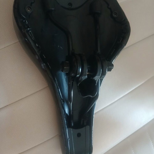 Carrera bicycle saddle like new with integrated rail clamp black