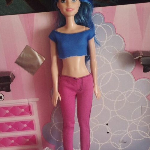 Barbie doll with blue hair