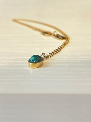 Necklace with blue stone like new, gold color