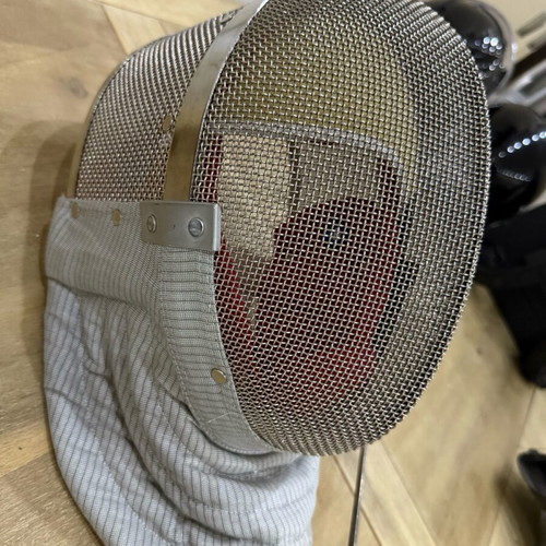 Fencing accessories used, helmet, sword, vest and bag