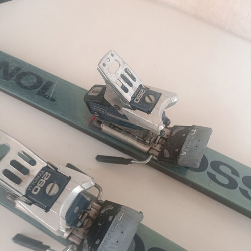 Rossignol STS Fibroplastic skis used with Tyrolia 260 bindings, Skitique poles, and Solomon SX81 325 boots