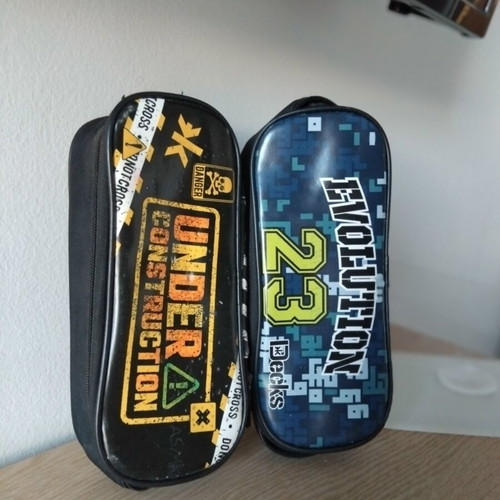 Decks & Under Construction oval pencil cases, set of 2
