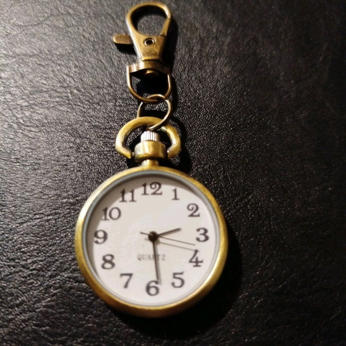 Quartz keychain watch like new, brass color, white dial
