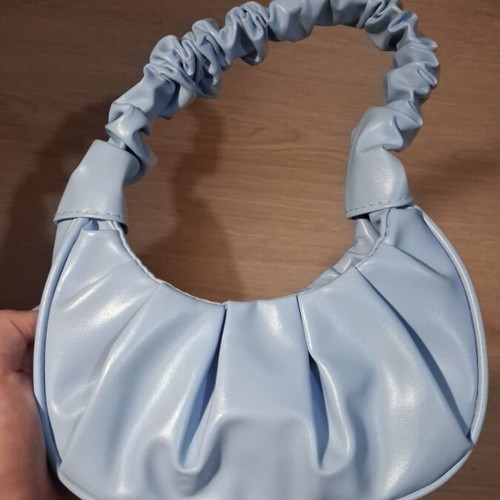 Blue leather handbag new with spacious capacity