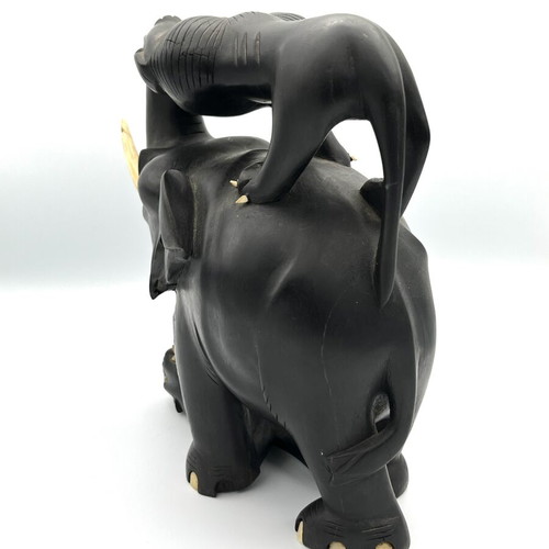 Vintage handmade ebony wood sculpture of elephant and lions