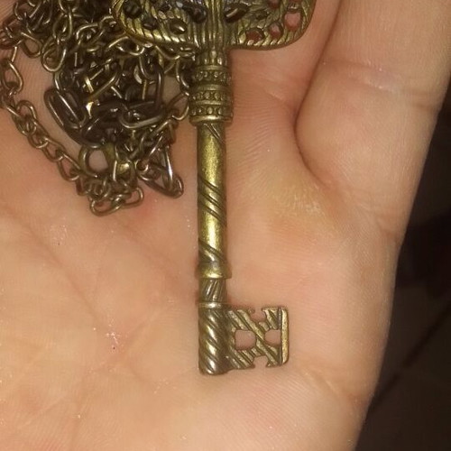 Antique key-shaped pendant like new