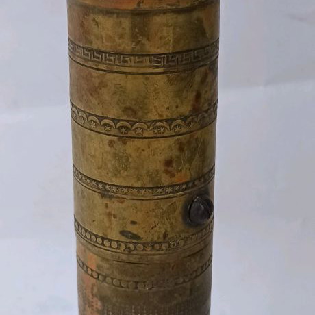 Brass prewar coffee grinder with engraved designs