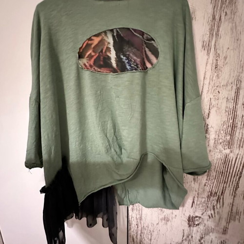 Asymmetric blouse made to order with Donatella details in black and green