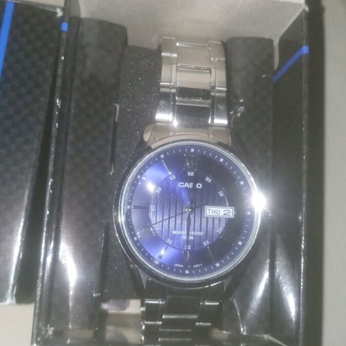 Casio men's watch with blue dial and silver bracelet, new
