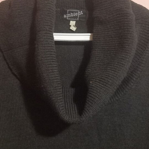 Long knitted gray dress used with loose neckline and decorative holes