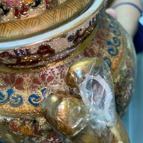 Ancient gilded vase with broken handle