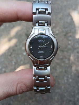 Omax Quartz Μοντέλο HB 0239 ρολόι σαν καινούργιο, ασημί unisex