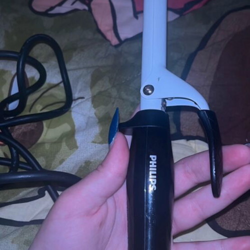 Hair curling iron used with some rust, functional