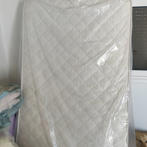 Single mattress used, white color, quilted with handles