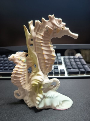 Porcelain decorative figurine with two seahorses used