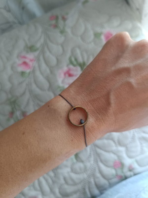 Bracelet with adjustable cord, like new, gray and gold