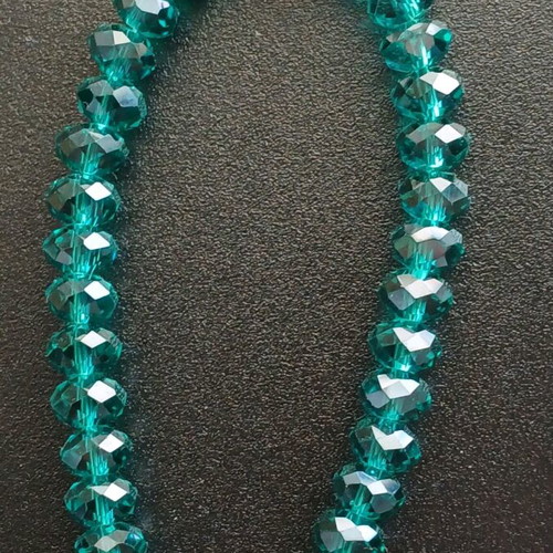Bracelet with crystal beads used, emerald/petrol color with fish motif