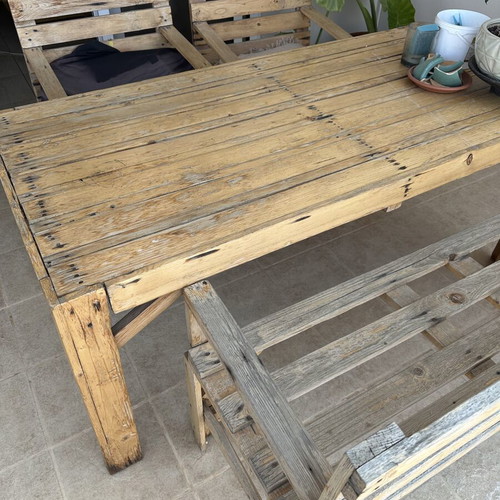 Handmade wooden table set with chairs and bench used