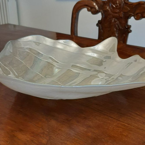 Three platters in the shape of a conch