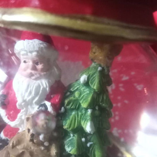 Christmas souvenir like new with Santa Claus and falling snow